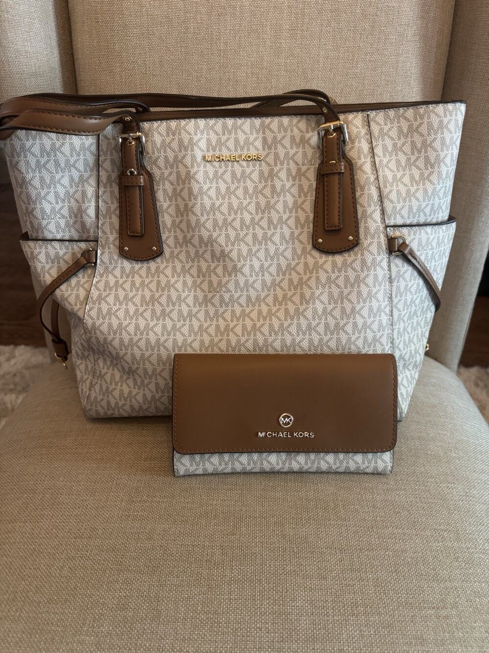 Michael Kors Voyager Large Tote Bag paired with its matching flap wallet.